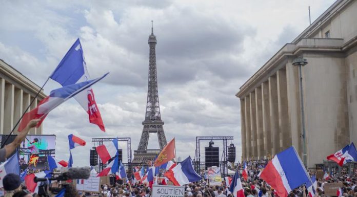 Plans for vaccine passes provoke protests in France, Switzerland and Italy